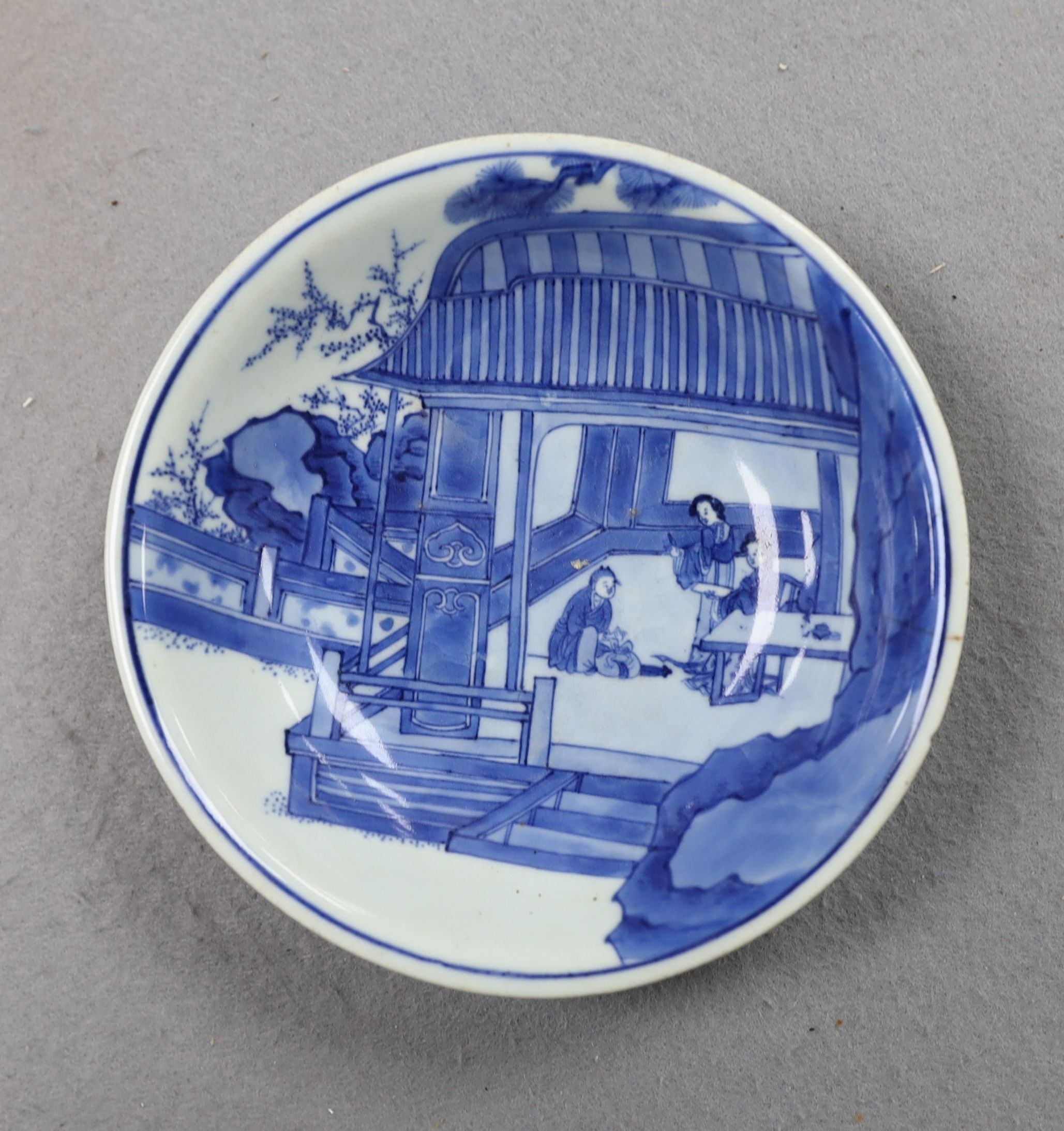 NB BOTH WITH HAIRLINE CRACKS A pair of Chinese blue and white small dishes, Kangxi six character marks and of the period (1662-1722), 15.7cm and 15.8cm diameter, foot later pierced, hairline cracks